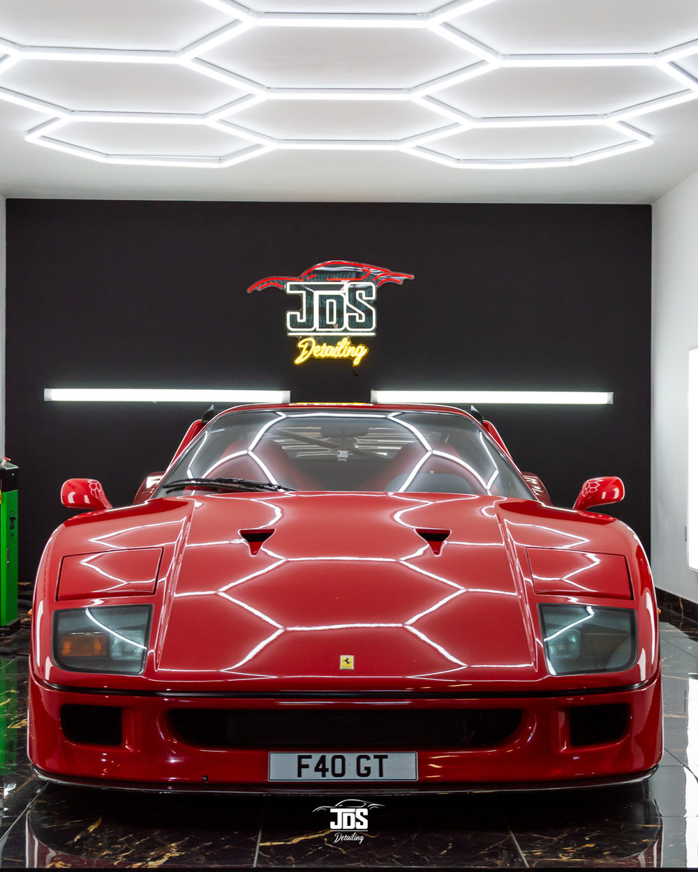 Red Ferrari F40 under the hexagon lights of the JDS studio