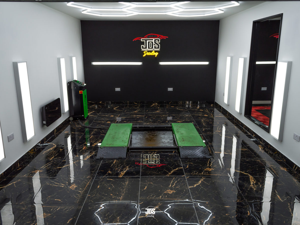 The JDS studio with hexagon ceiling lights and a gloss floor