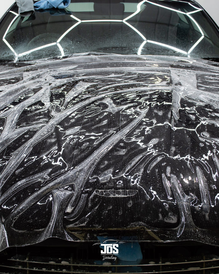 Film laid wet across a black bonnet