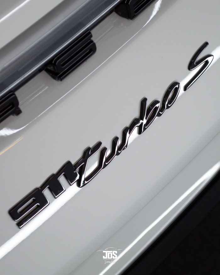Porsche 911 Turbo S badge on protected paint