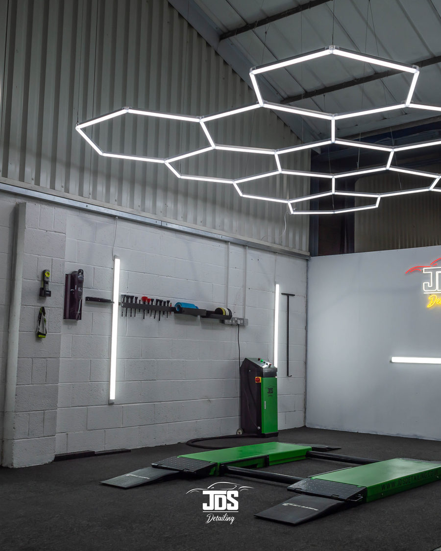Inside the JDS studio: hexagon ceiling lights, lifts and product wall