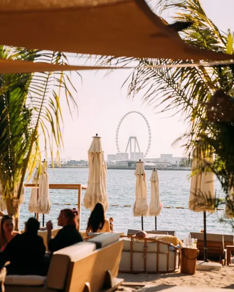 Beachfront seating at Surf Club’s Sunday brunch with Dubai skyline view