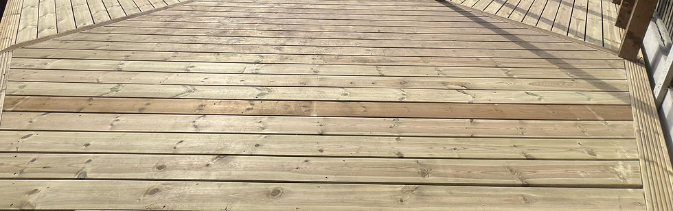 Close‑up of newly installed pressure‑treated timber decking boards by a Nottingham decking company – decking services Nottingham