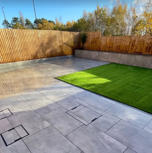 Synthetic grass installation alongside porcelain paving in Chesterfield