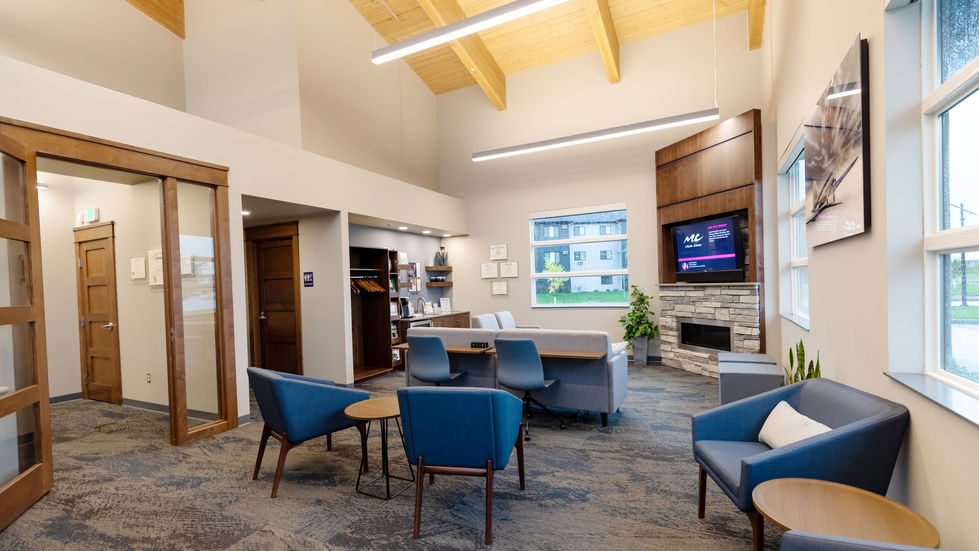 Lobby/ waiting area with a high exposed glulam ceiling.
