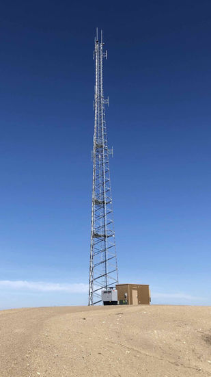 Communications tower array on top of a hill.