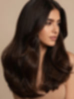 Woman with long wavy hair at Dominican Salon Lauderhill