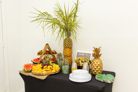 A tropical-themed fruit bar setup.
