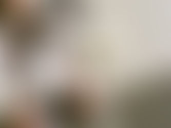 Two people review printed fashion photos on a table, crossing out images labeled “Off-brand,” “Stage,” and “Too Clean.” A sticky note nearby reads, “Try again. But cooler.”