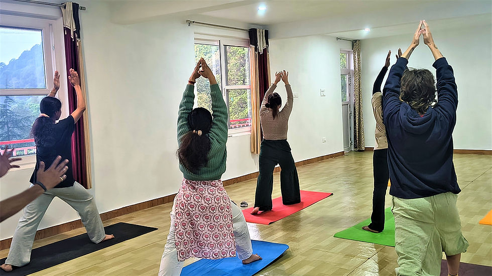 People practicing yoga and meditation at a luxury Himalayan retreat with mountain views during an 8-day wellness and spiritual journey.