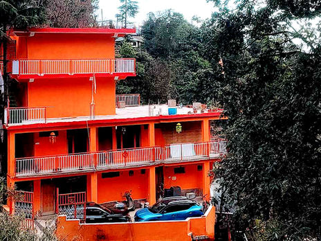 Students practicing yoga poses during a 200 hour yoga teacher training program at a peaceful international retreat setting