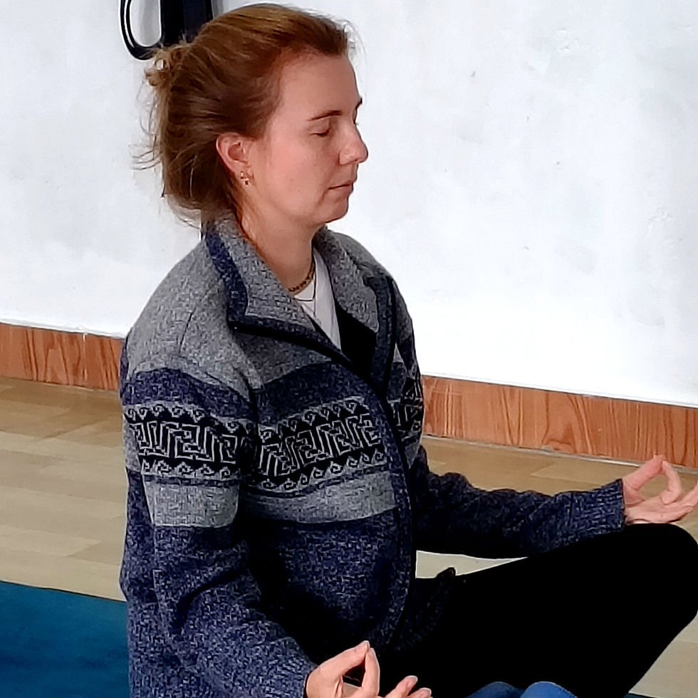 Sunrise yoga practice surrounded by the Himalayan mountains during an authentic yoga teacher training retreat in India.