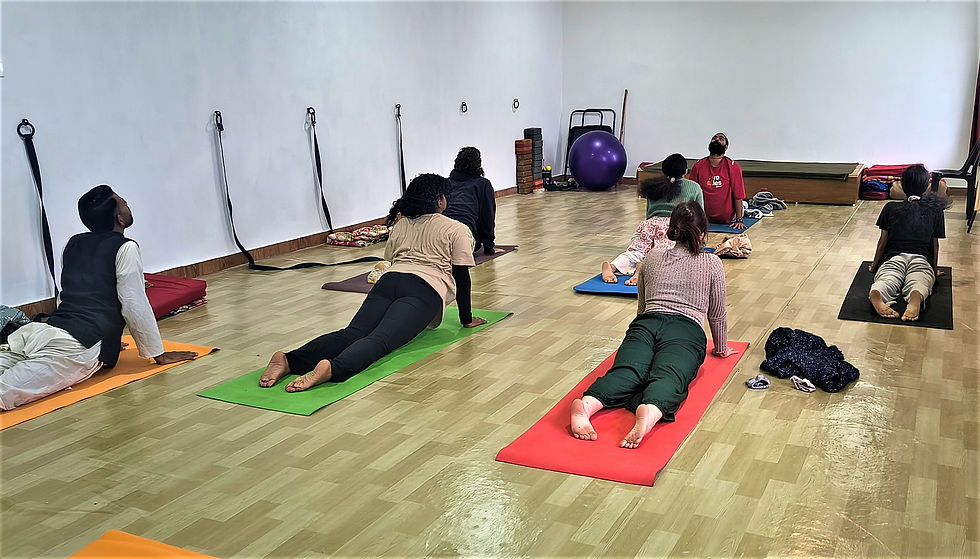 Students practicing yoga during a 200-hour yoga teacher training in the Himalayas