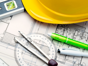 construction hard hat on construction drawings