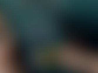 Finger tapping a "Donate" button on a smartphone screen displaying "Help us to make a better world." Background is dark with text.