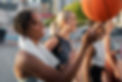 female friends playing basketball