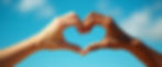 hands-forming-heart-against-sky.jpg