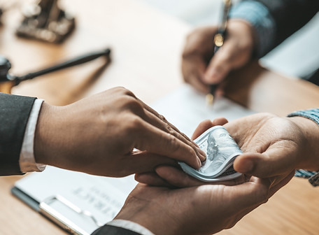 two-people-are-doing-corrupt-behavior-they-are-mutual-business-partners-are-signing-contra