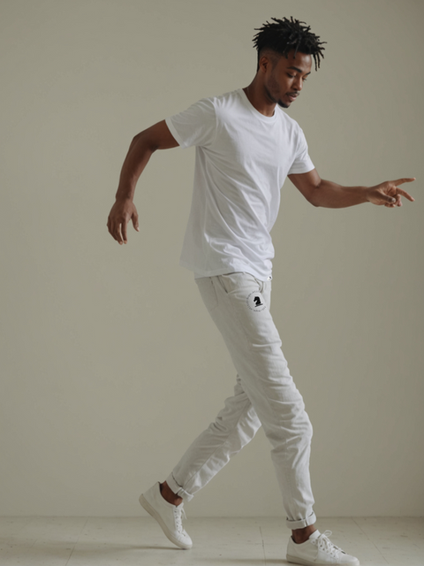 Man dancing while wearing plain white clothes by Ropestitch.