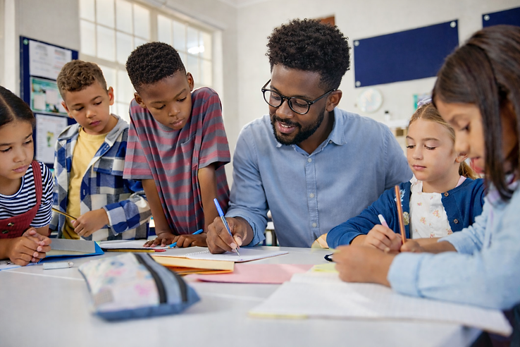 Teacher guiding students in classroom.png
