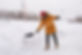 man-is-clearing-snow-near-house-staircases-hovelling-winter-season-winter-storm.jpg