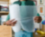 A MALES HANDS HOLDING OUT BUBBLE WRAP