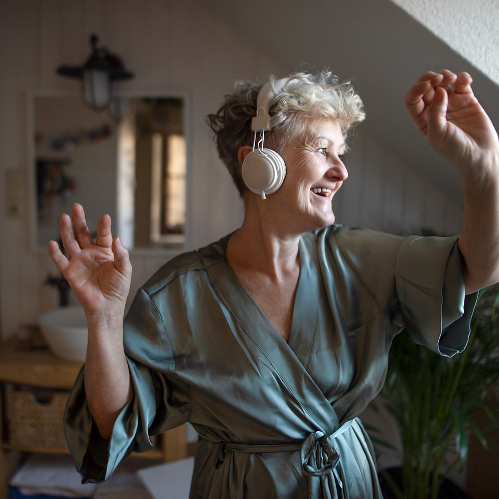 older woman enjoying music