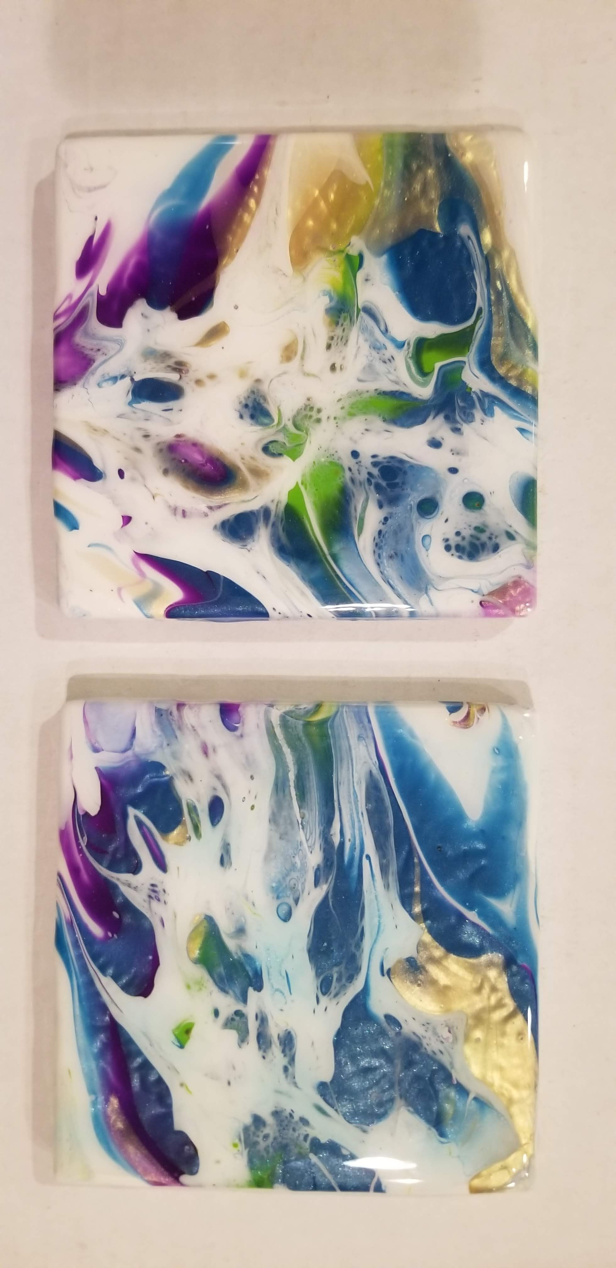Acrylic pour on tile with resin and cork back.