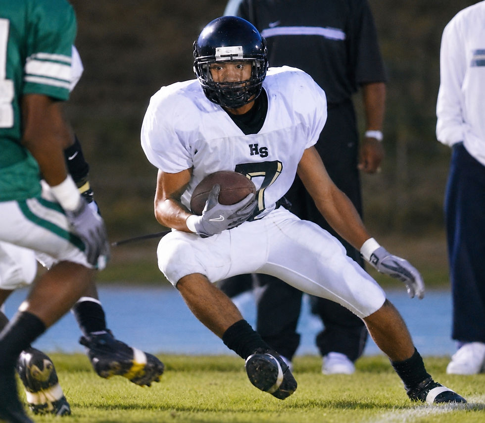 2003 - Victor “Macho” Harris eluding a defender - Photo Courtesy of Mark Gormus/RTD