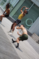 3 contemporary dancers performance on boardwalk
