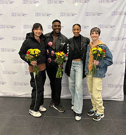 Davi, Kennyth, Taja, and Erin holding flowers with NBPAC Screen background