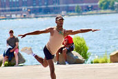 Black contemporary dancer in dynamic pose on waterfront