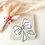 Miniature : Nœuds en papier coloré utilisés comme marques-places personnalisés pour une table festive et créative