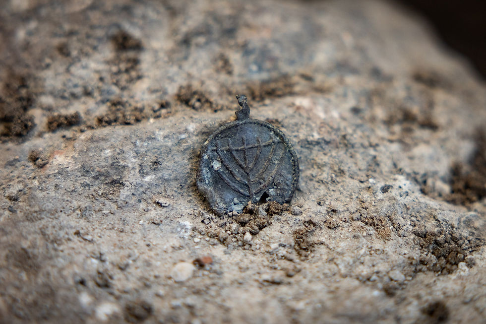 A 1,300-year-old pendant with a Menorah was just found near the Western Wall in Jerusalem. Photos by Yonatan Sindel/Flash90