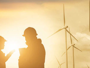 engineers infront of windfarm