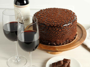two glasses of wine and chocolate cake
