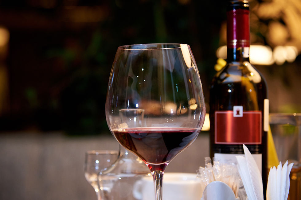 red wine glass and bottle