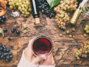 woman holding red wine