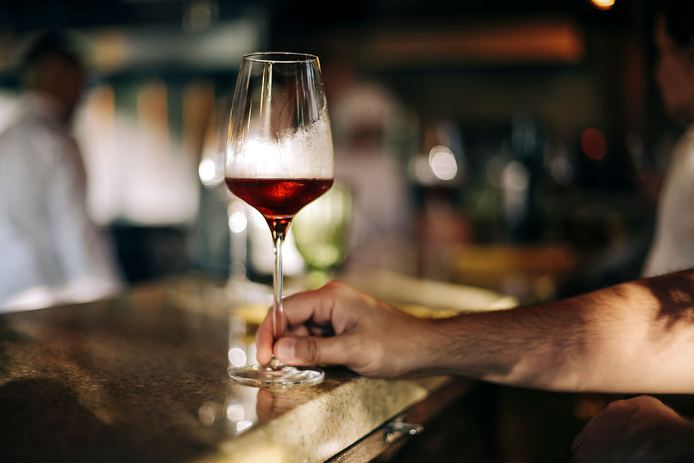 man holding wine glass stem