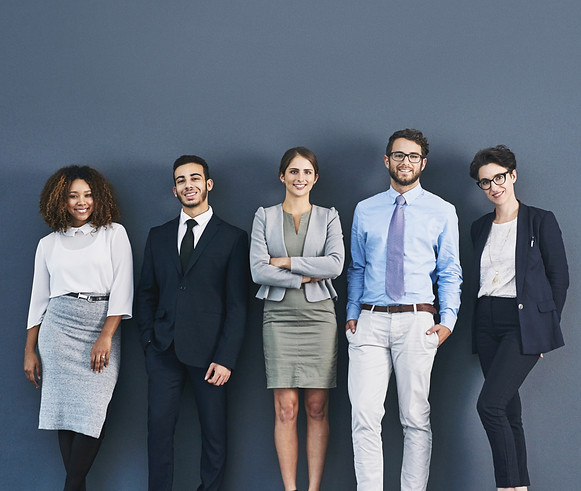 corporate-confidence-its-best-studio-shot-group-businesspeople-standing-line-against-gray-