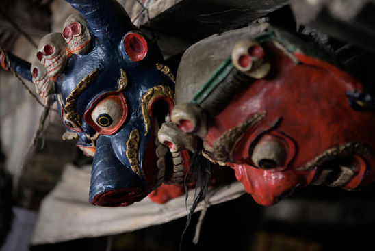 A detail of two masks in the tibetan style hanging on a beam of a buddhist temple.

Zanskar valley - Ladakh, June 2022