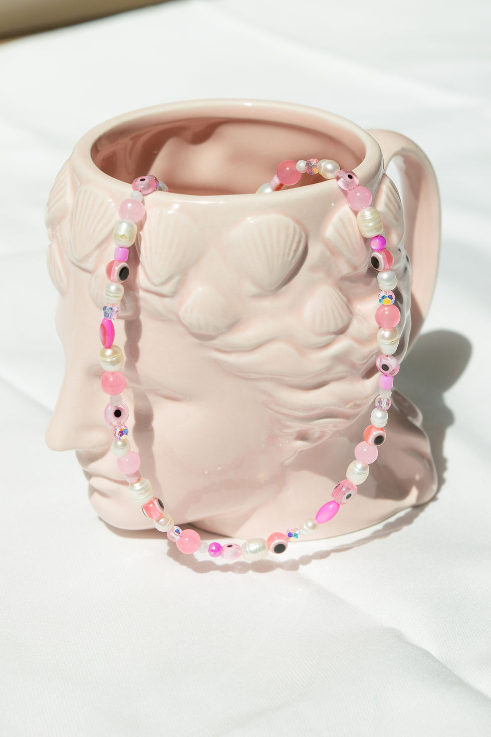 Collier mauvais oeil rose