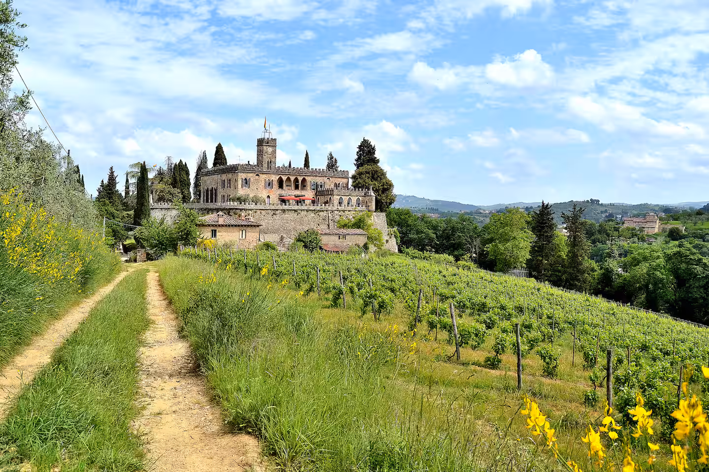 Historic castle wedding venue in Tuscany, surrounded by vineyards and olive groves