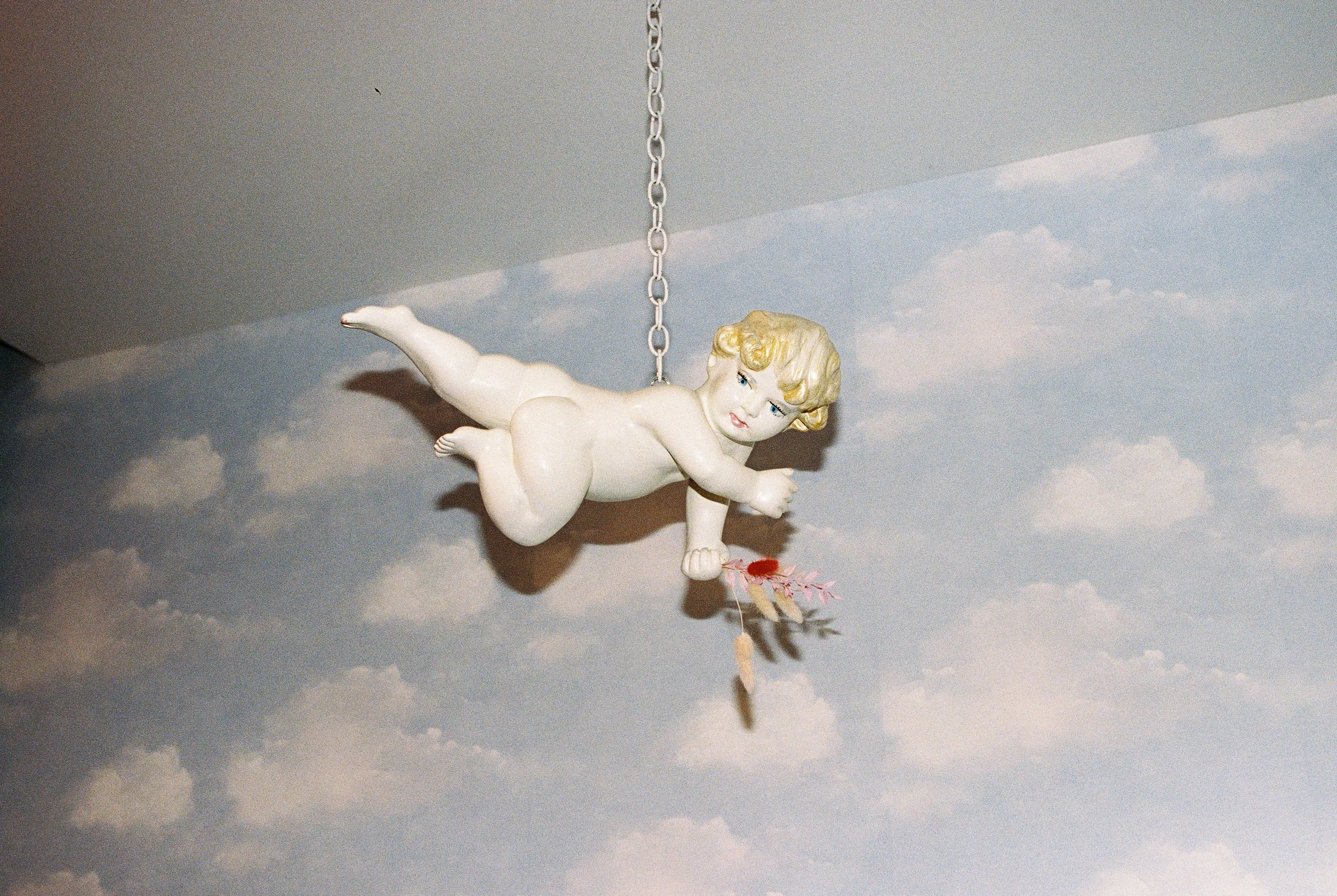 cherub hanging at sure thing chapel vegas wedding venue