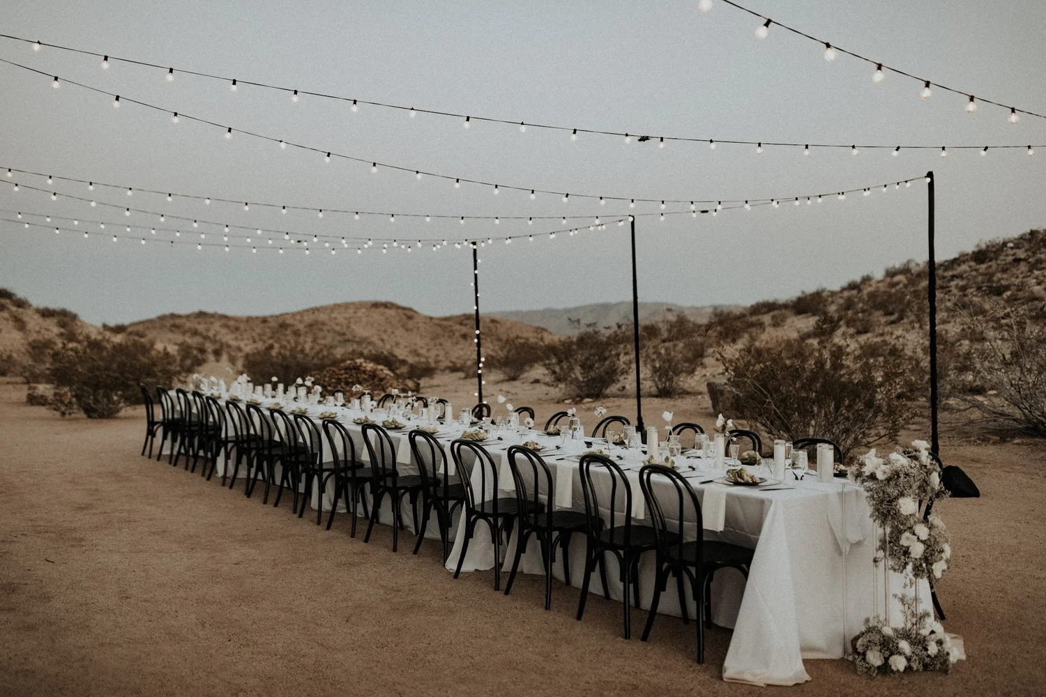long reception table during desert wedding reception at morada joshua tree wedding venue
