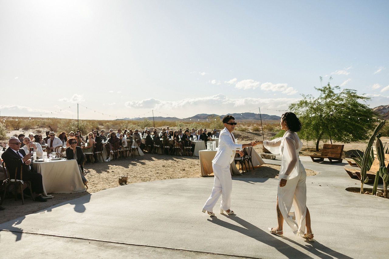 lesbian couple dancing in the desert at nxwhere california captured by marissa kay photography joshua tree wedding photographer