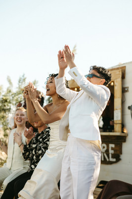 brides enjoying live music during cocktail hour at their wedding
