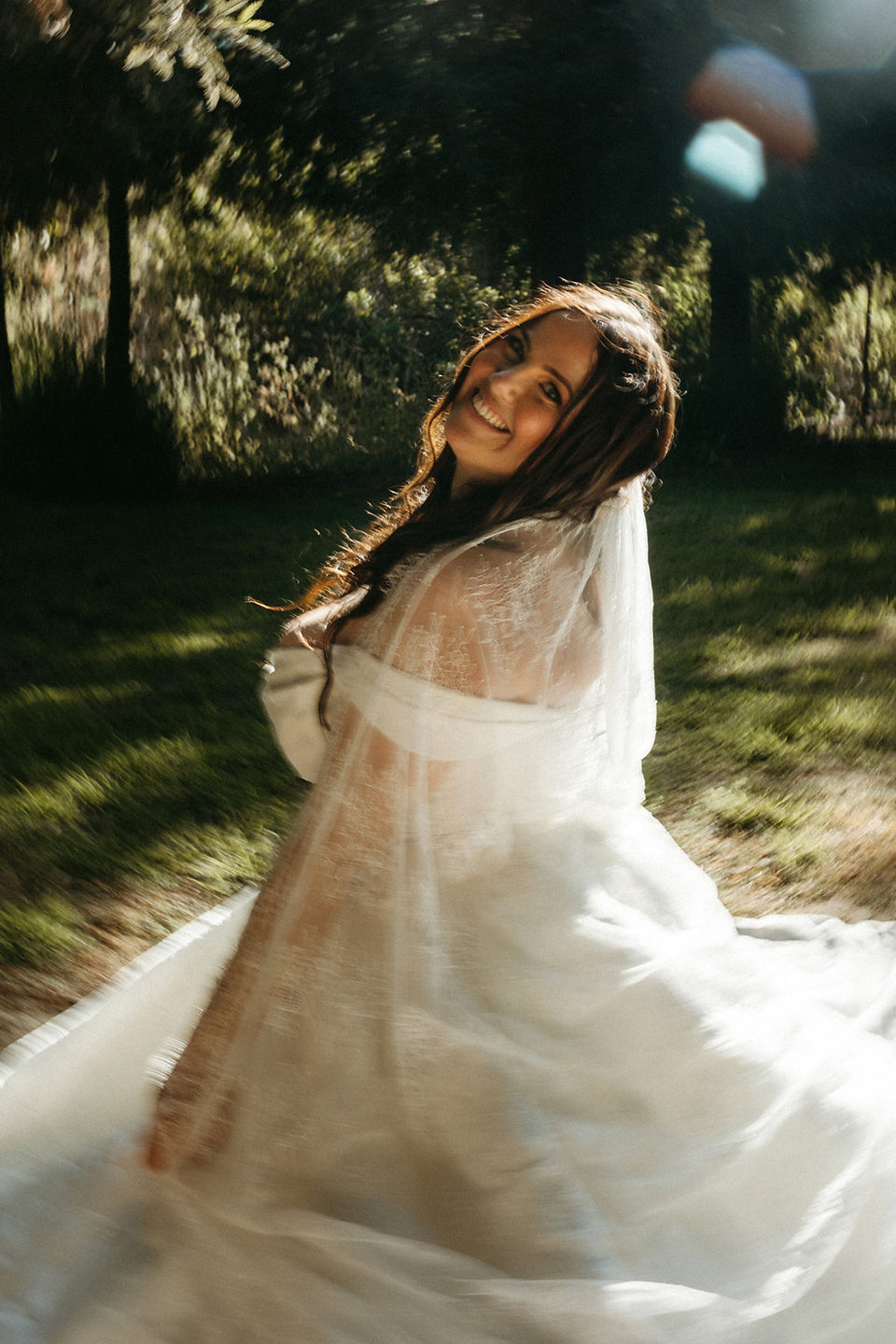 unique bridal portrait of bride sitting on grass