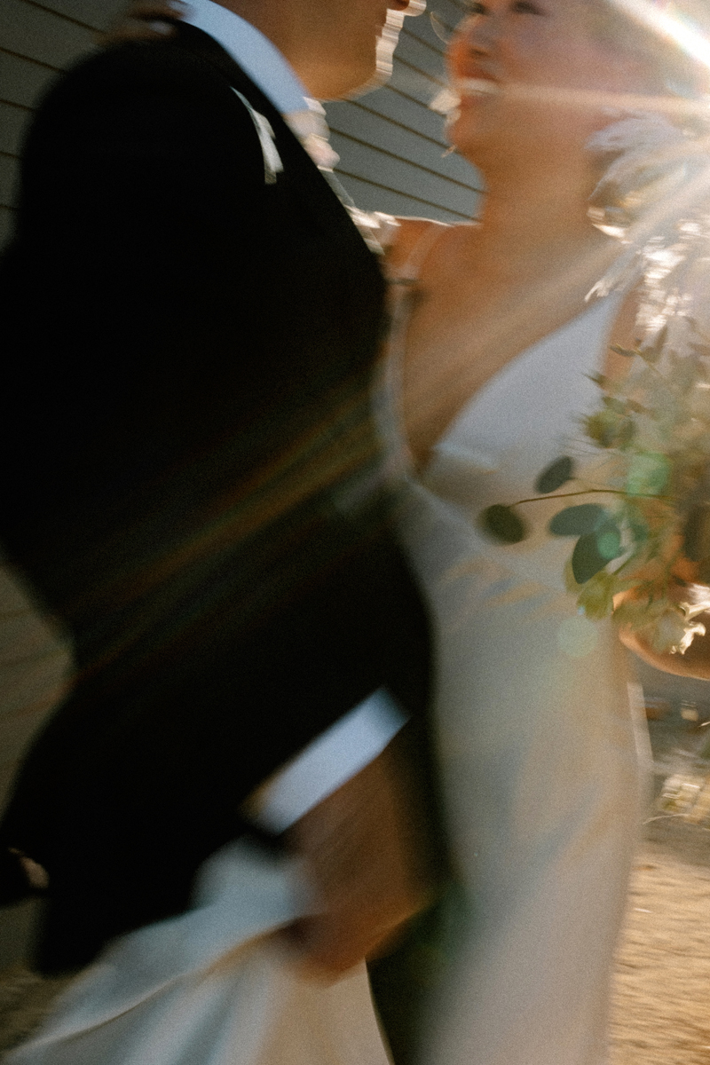 sun flare over bride and groom in joshua tree elopement