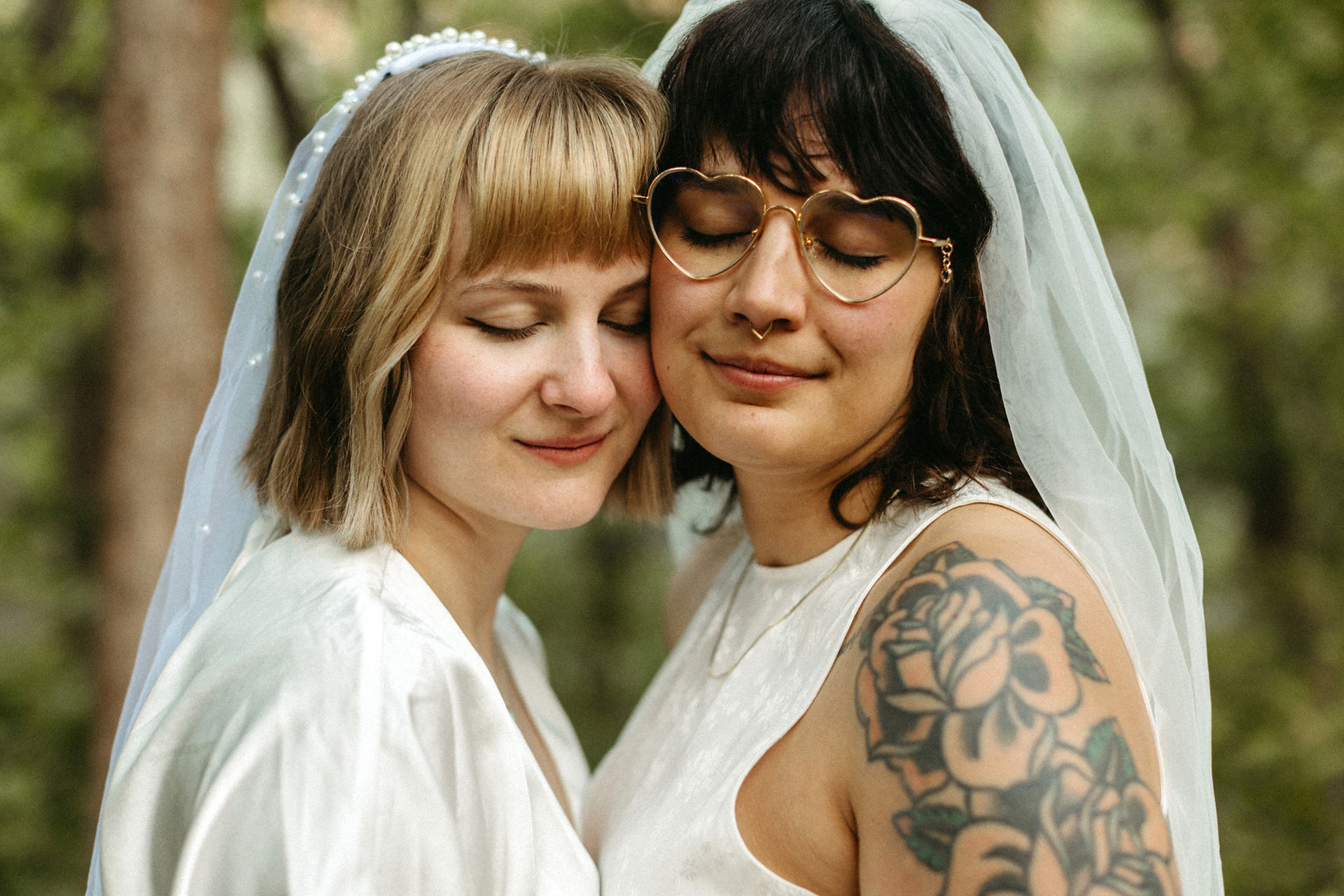two brides standing cheek to cheek during zion national park elopement